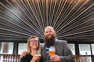 Green Flash's Liz Bradshaw and Dave Adams toast the debut of Cellar 3 from behind the bar.